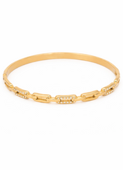 Gold bracelet with diamond accents on a white background